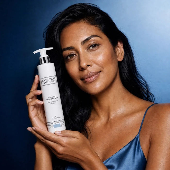 A client holding Katherine Daniels Essential Cleansing Milk